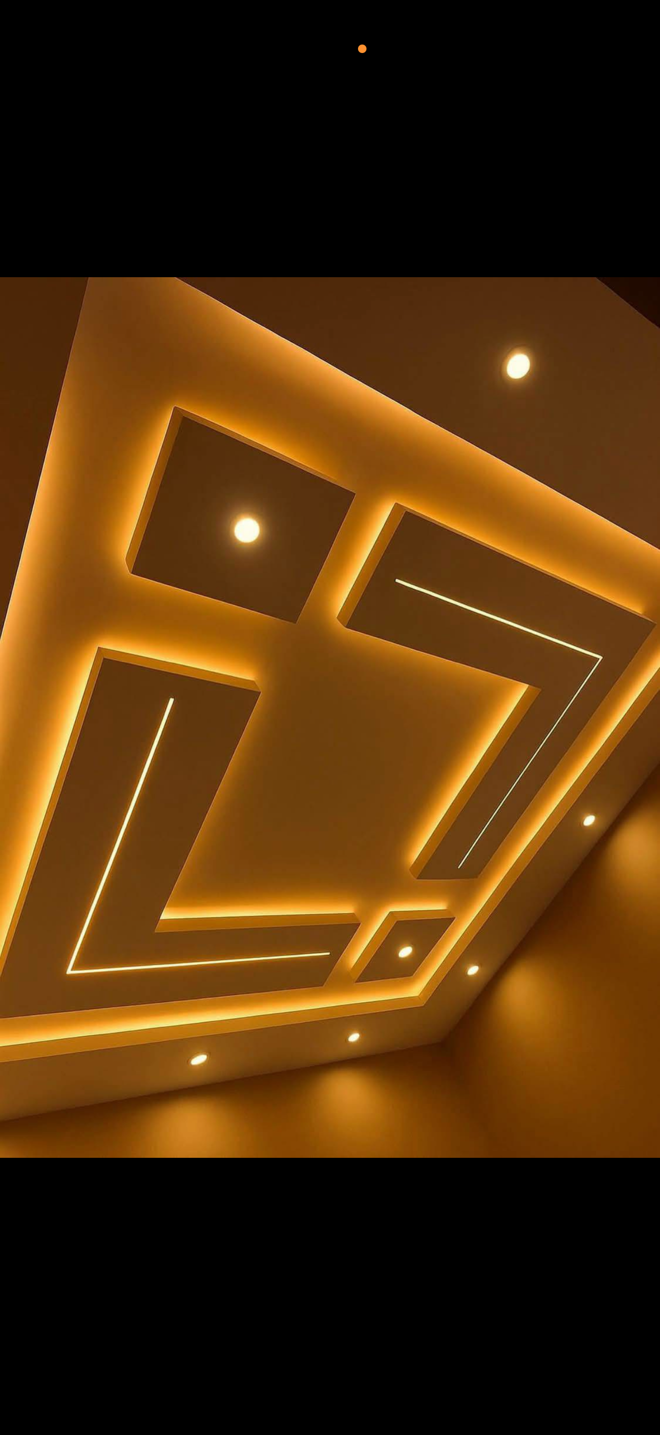 Bold maze-like drywall ceiling with interlocking squares outlined in warm gold LED strip lighting